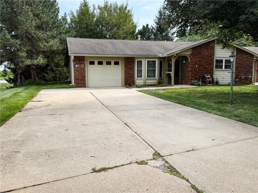 1303 W Stone Blvd, Raymore, MO 64083