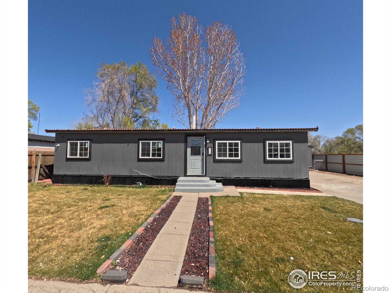 218 Crest Dr, Log Lane Village, CO 80705